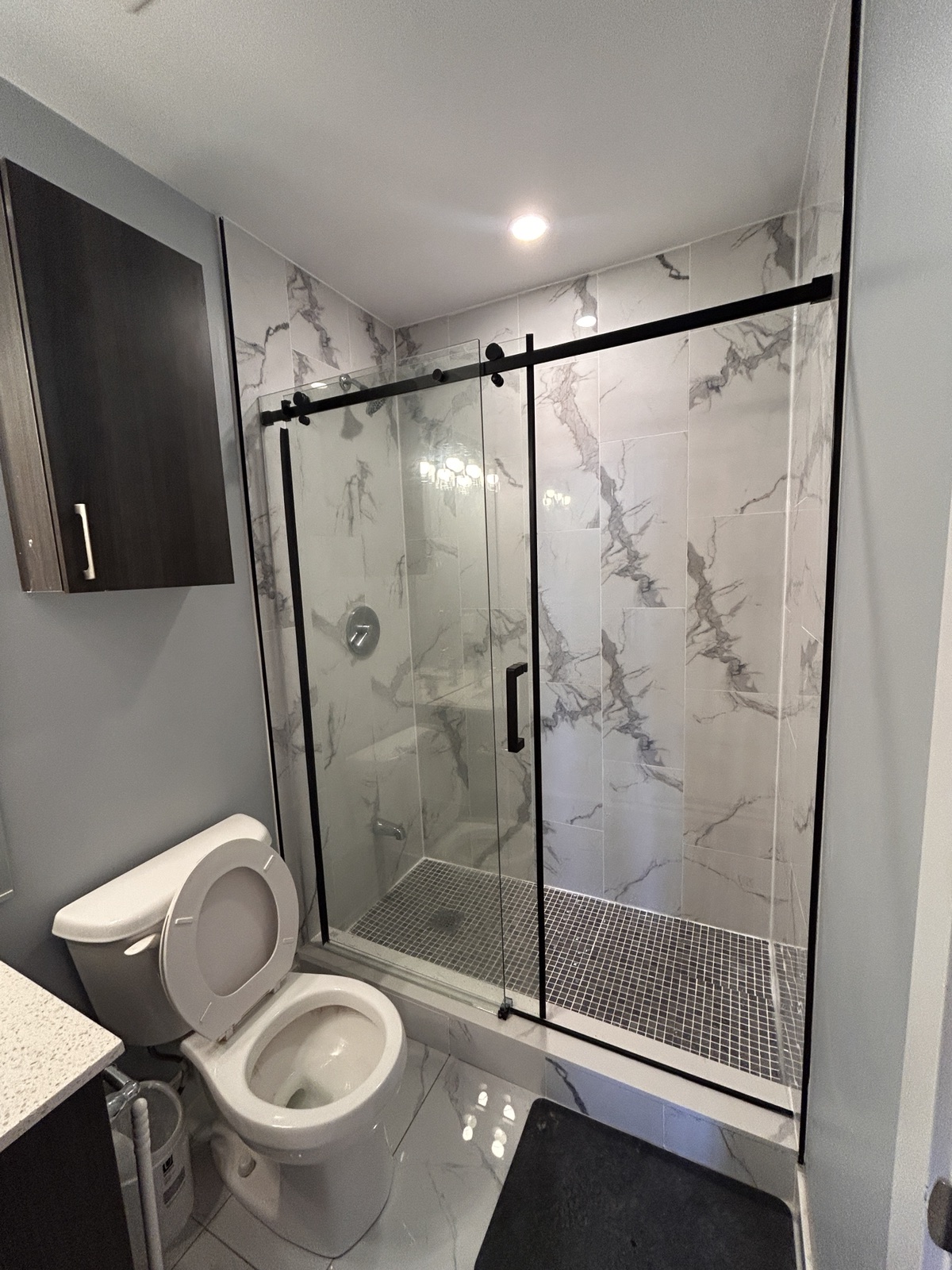 Finished shower and plumbing fixture context from a documented renovation sequence