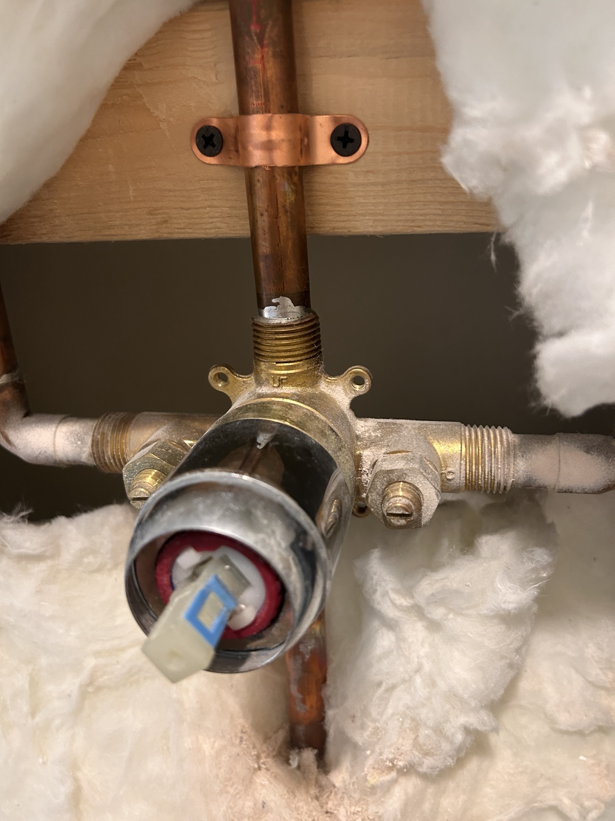 Shower valve body and copper supply piping secured inside an open wall
