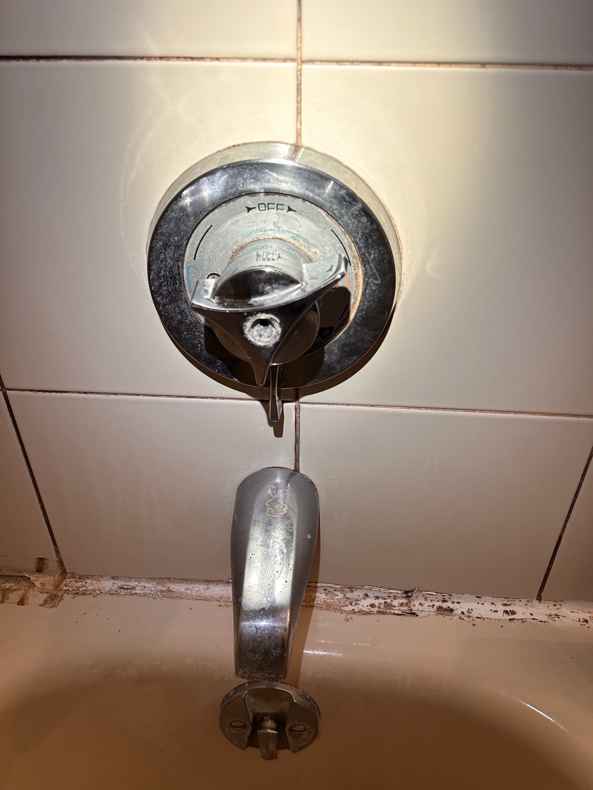 Existing bathtub and shower valve control before disassembly